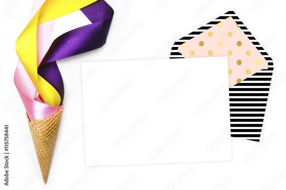 Flat lay, white background. Party photo, ice scream cone and colored ribbons. White background mockup Flat lay, white background. Party photo, ice scream cone and colored ribbons. White background mockup