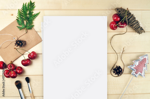 Wood desk table, envelope and cherry, invitation. Flat lay