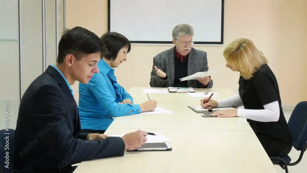 Group of business people brainstorming together in the meeting room Group of business people brainstorming together in the meeting room