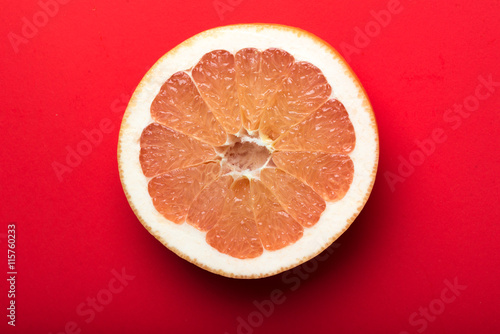 grapefruit with red background