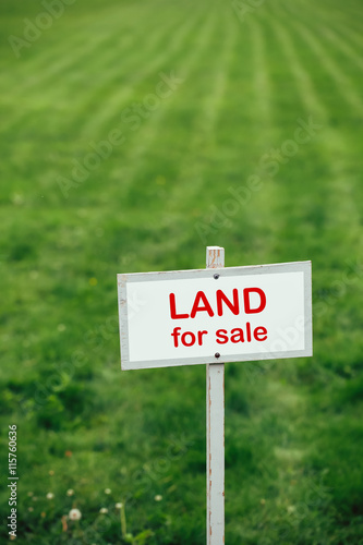 Wallpaper Mural land for sale sign against trimmed lawn background Torontodigital.ca