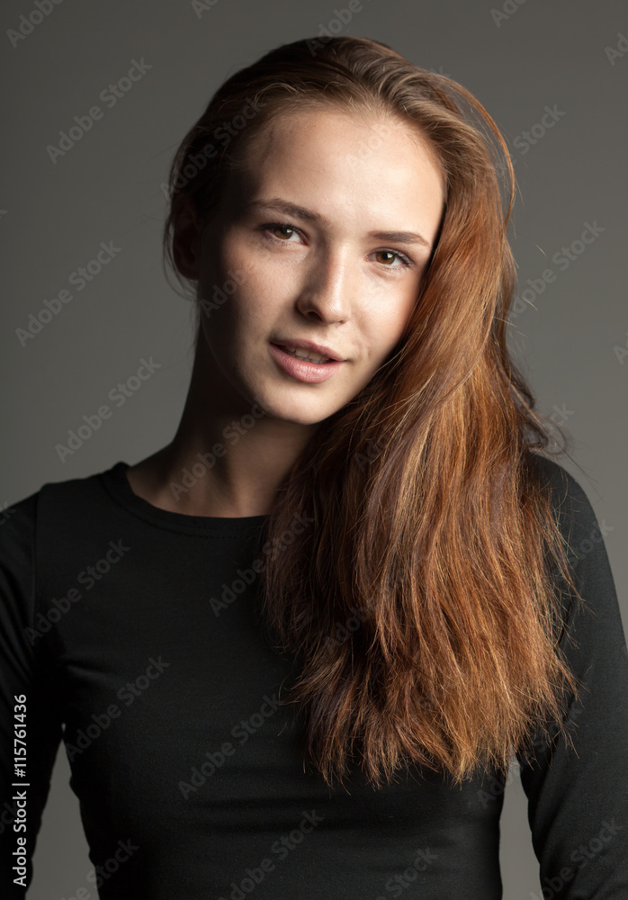 portrait of gorgeous young woman on gray studio background portrait of gorgeous young woman on gray studio background