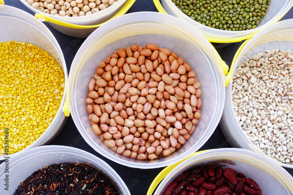 Fototapeta premium Mixed beans and lentils of different legumes on black background