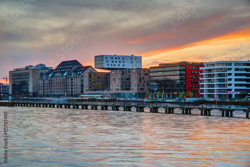 Sunset at the river Spree in Berlin with modern office buildings at the riverbank
