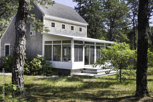 Salt box house in the forest in Wellfleet, MA on Cape Cod.