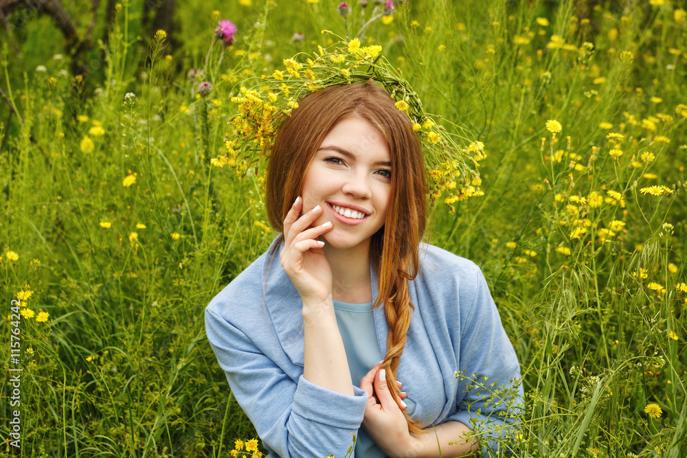 Girl in a wreath of wildflowers. Girl in a wreath of wildflowers.