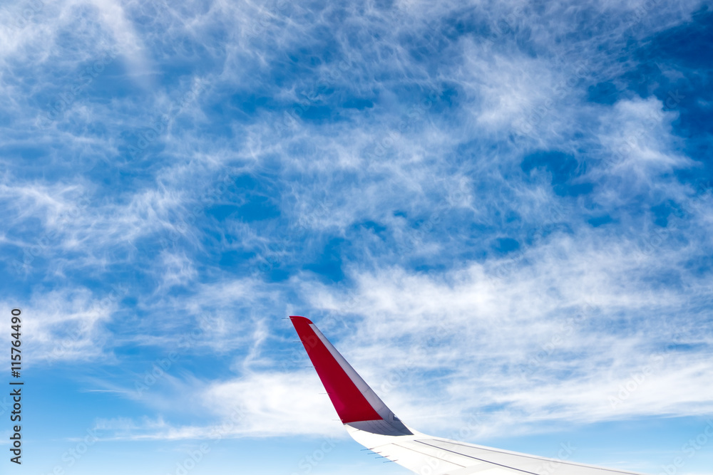 Fototapeta premium Aerial view of cloud and sky with airplane wing from airplane wi