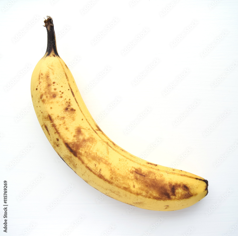 Overripe banana ready to eat, isolated on white background