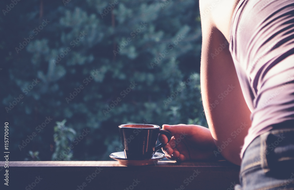 Girl with a Cup of coffee in the garden - obrazy, fototapety, plakaty 