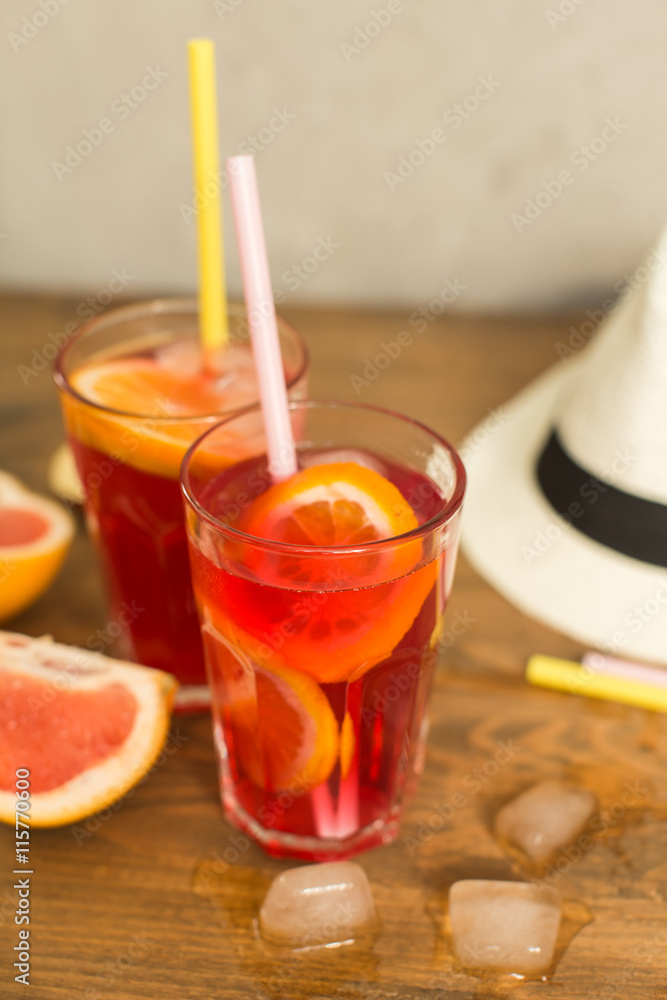 two glasses of fruit drink blackcurrant with hat on table two glasses of fruit drink blackcurrant with hat on table