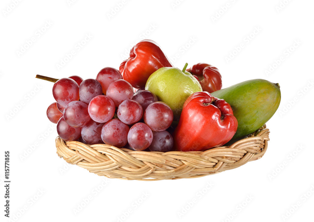 mixed fruits in rattan basket on white background mixed fruits in rattan basket on white background
