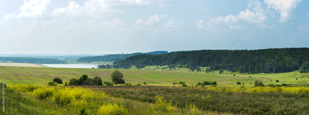 Wonderful summer panoramic view of fields and motorway
