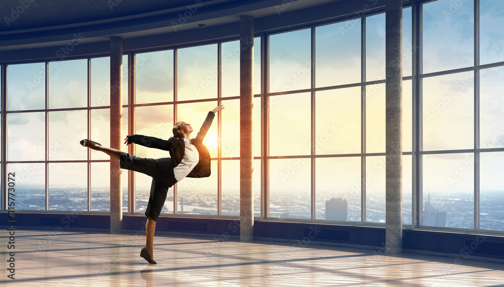 Dancing businesswoman in office . Mixed media Dancing businesswoman in office . Mixed media
