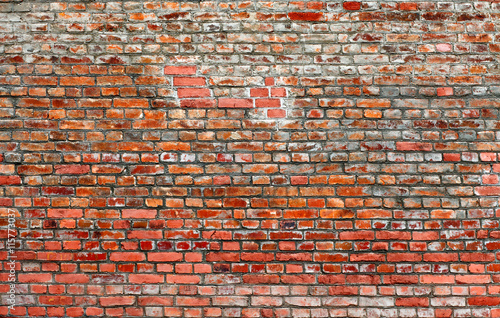 Old red brick wall background. 