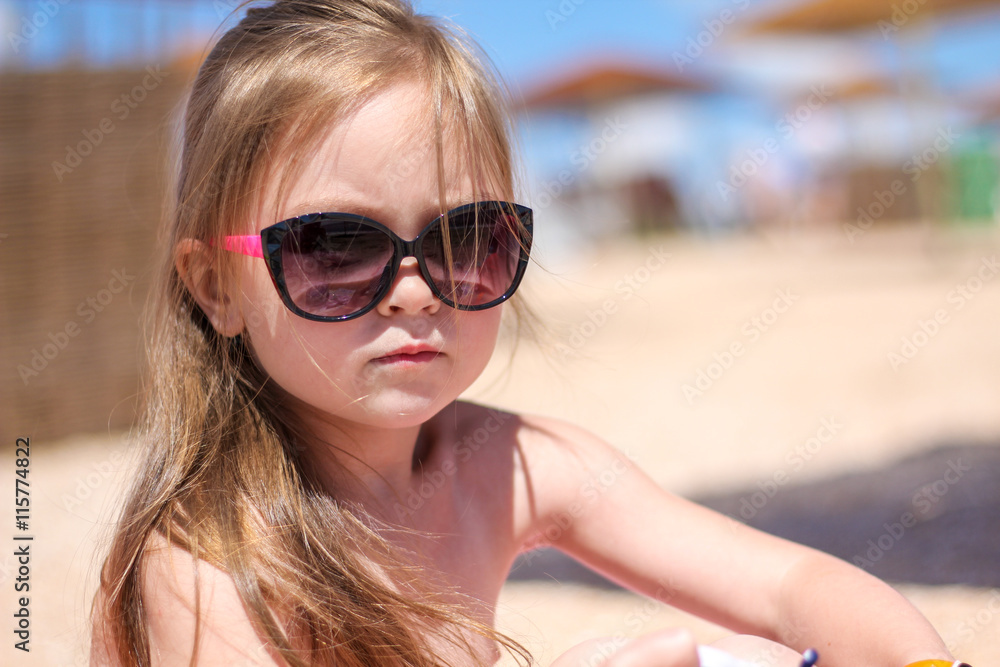 Little baby girl on the sand beach Little baby girl on the sand beach