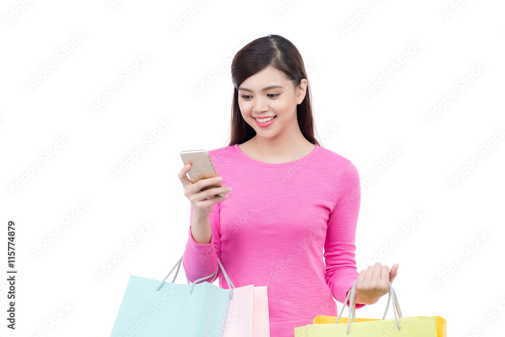 Shopping asian woman with mobile phone on white background. Shopping asian woman with mobile phone on white background.