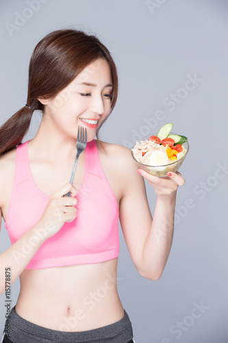 woman eat salad and smile