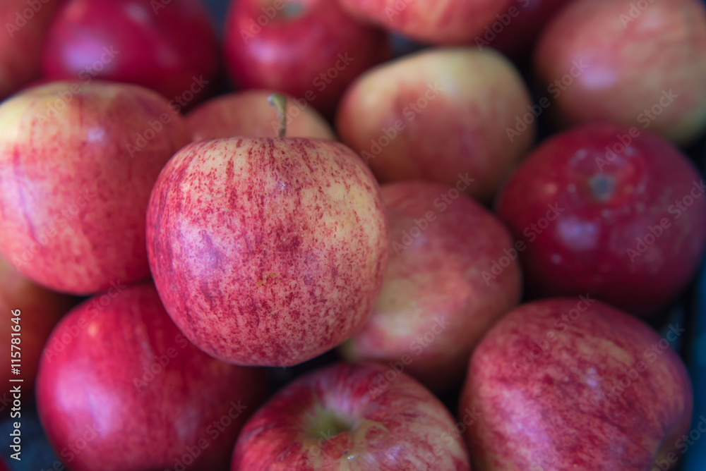 Fresh Red apples fruit is very much on the market background Fresh Red apples fruit is very much on the market background