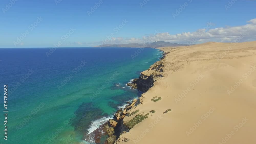 AERIAL: Sandy desert and Atlantic ocean joining in stunning beach AERIAL: Sandy desert and Atlantic ocean joining in stunning beach