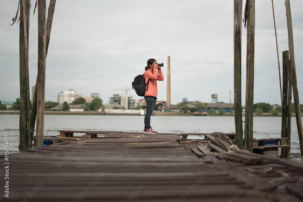 photographer taking a photo with river view photographer taking a photo with river view