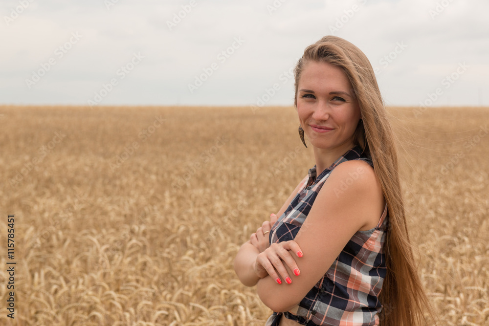 Happy young woman in golden wheat field Happy young woman in golden wheat field