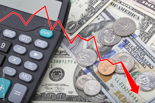 Graph showing USD bank notes with coins and a calculator