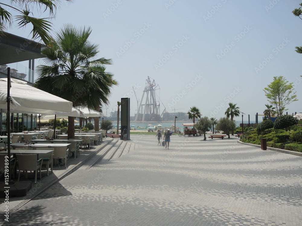 Dubai Jumeirah Beach with the Dubai Eye in progress on Arabian Gulf. Dubai Jumeirah Beach with the Dubai Eye in progress on Arabian Gulf.
