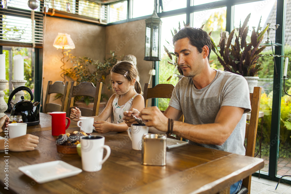 Family of three having breakfast at home Family of three having breakfast at home