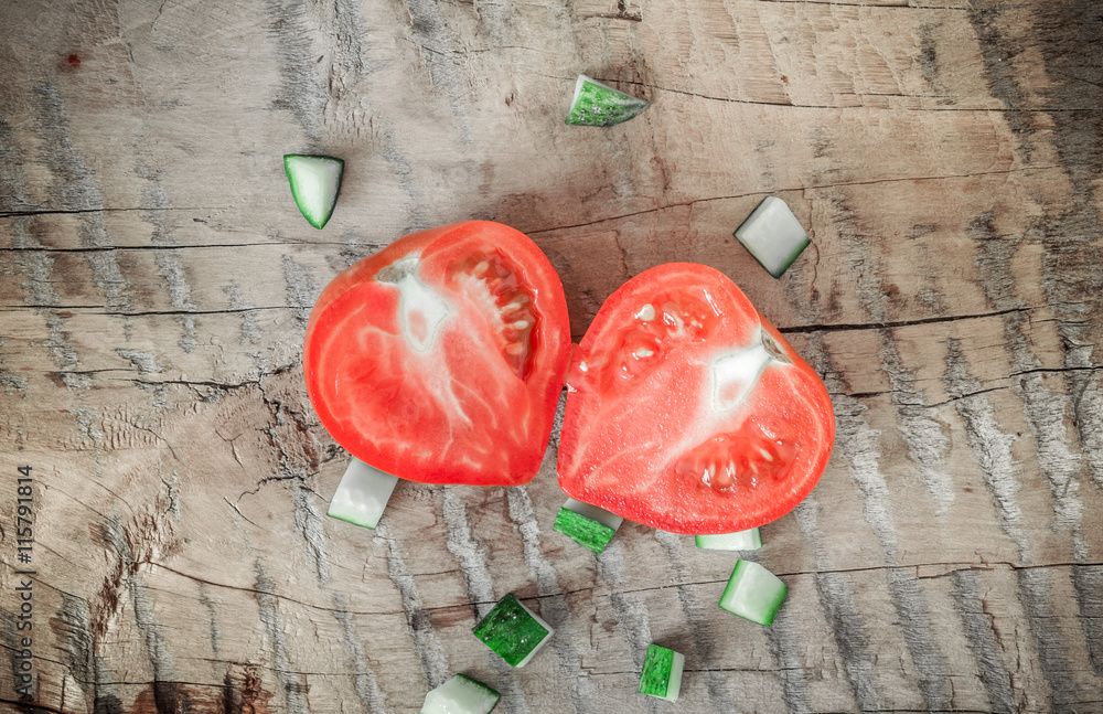 Cucumber on a wooden board. Tomatoes and cucumbers. Vegetables on a wooden table. Green. Cucumber on a wooden board. Tomatoes and cucumbers. Vegetables on a wooden table. Green.