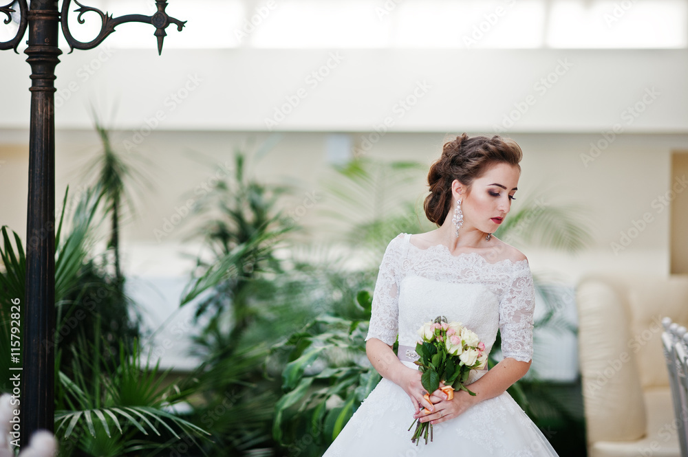 Portrait of beautiful bride at wedding hall background lantern