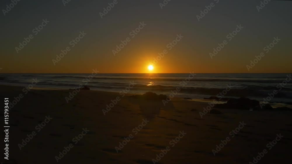 AERIAL: Amazing golden sun setting on exotic sandy beach AERIAL: Amazing golden sun setting on exotic sandy beach