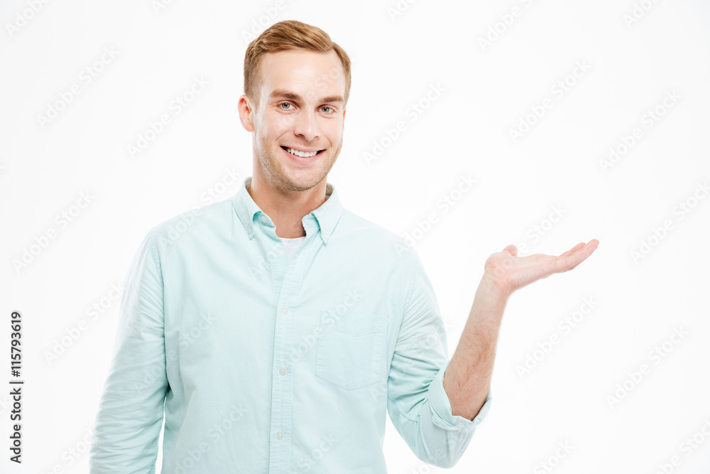 Full length portrait of man holding copyspace on the palm Full length portrait of man holding copyspace on the palm