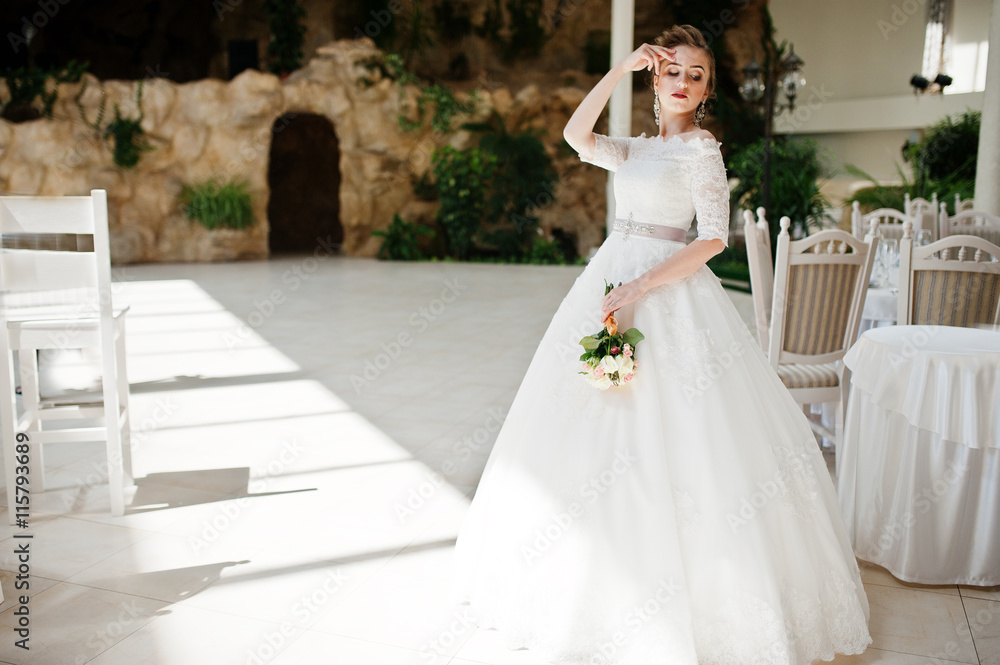 Fototapeta premium Portrait of beautiful bride at wedding hall