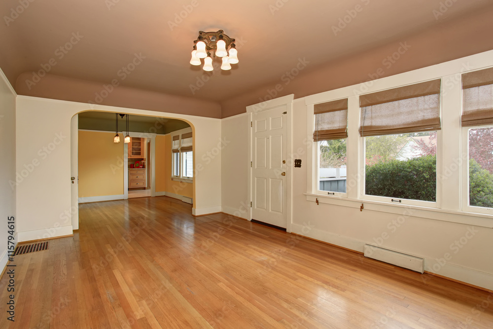 Fototapeta premium Empty living room interior with mocha ceiling and hardwood floor