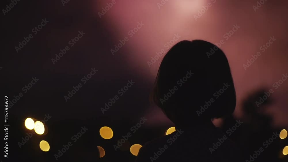 Unrecognizable child watching fireworks Unrecognizable child watching fireworks