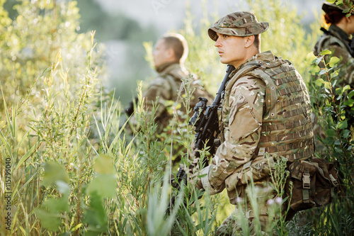 Special forces soldiers with weapon take part in military maneuv