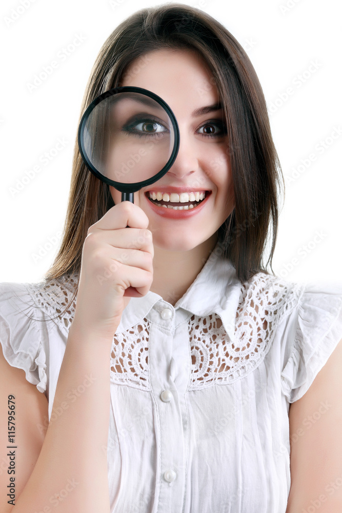 Beautiful girl portrait looking through magnifier. Isolated Beautiful girl portrait looking through magnifier. Isolated