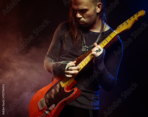 The guitarist plays solo. © Voloshyn Roman