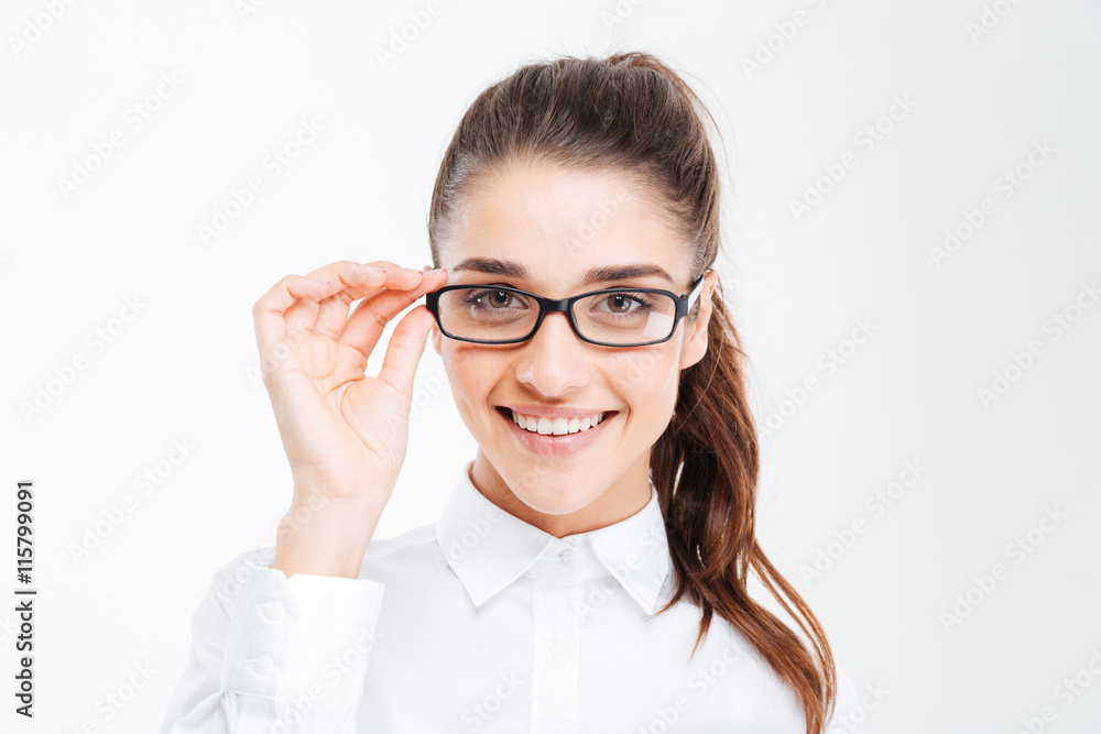 Portrait of cheerful attractive young businesswoman in glasses