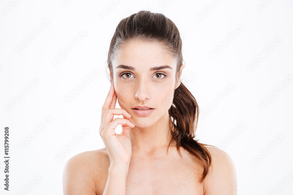 Beauty portrait of sensual young woman touching skin on face Beauty portrait of sensual young woman touching skin on face