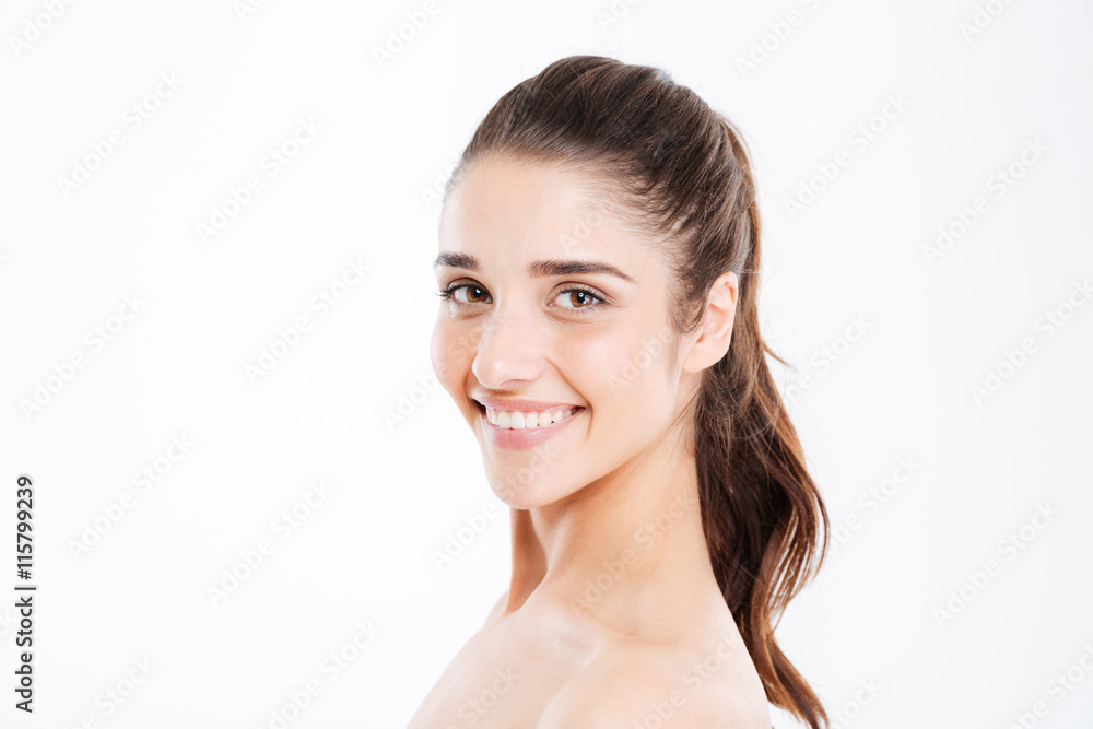 Beauty portrait of smiling young woman looking at camera Beauty portrait of smiling young woman looking at camera