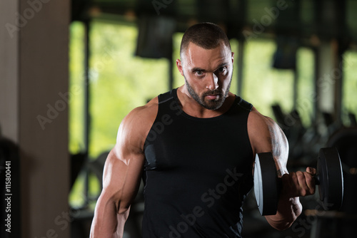 Beard Man Exercise Biceps With Dumbbells