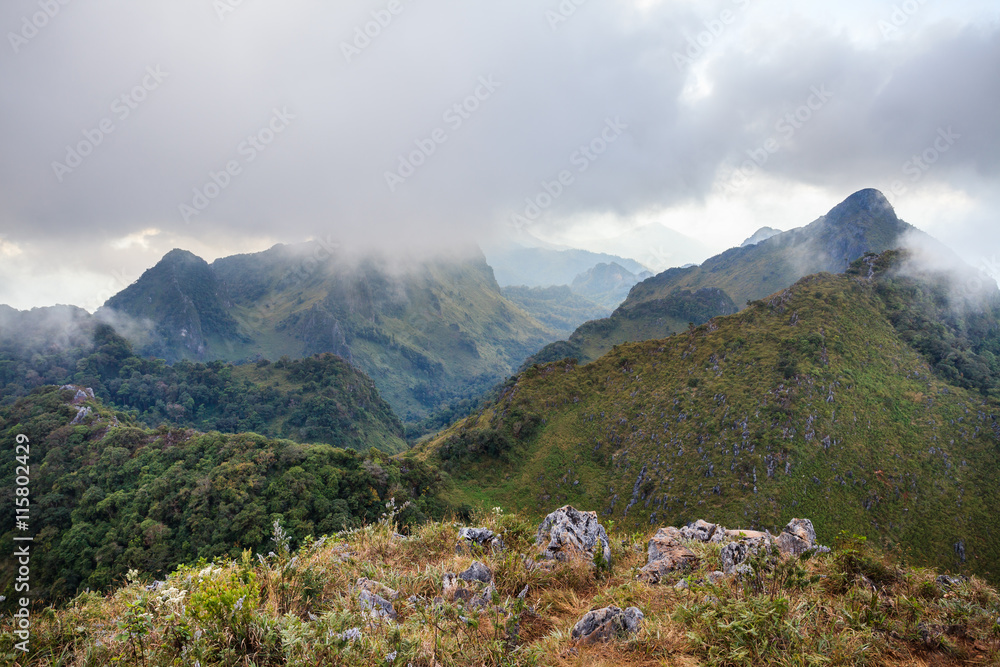 mountain peak and raining fog blue sky mountain peak and raining fog blue sky