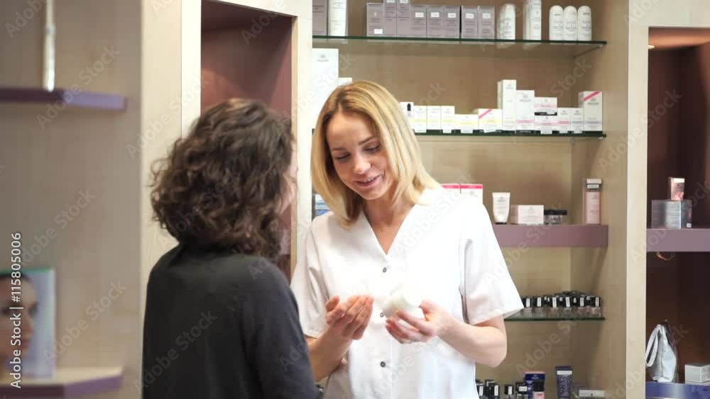View of a Beautician woman get credit card of customer to do payment View of a Beautician woman get credit card of customer to do payment