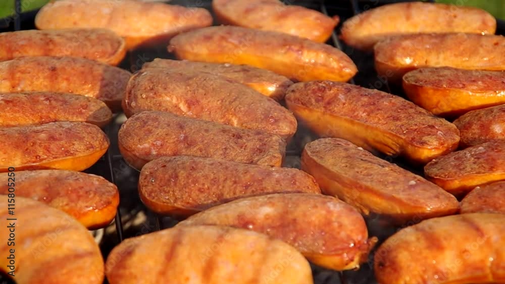 Grilled sausages on the grill in the summer
