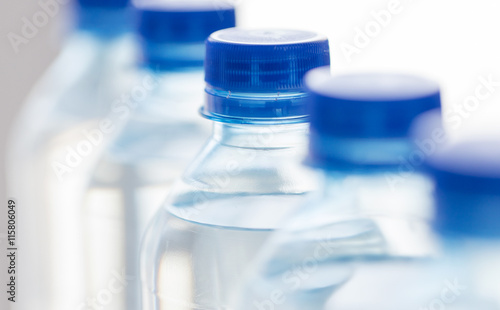 close up of plastic bottles with drinking water