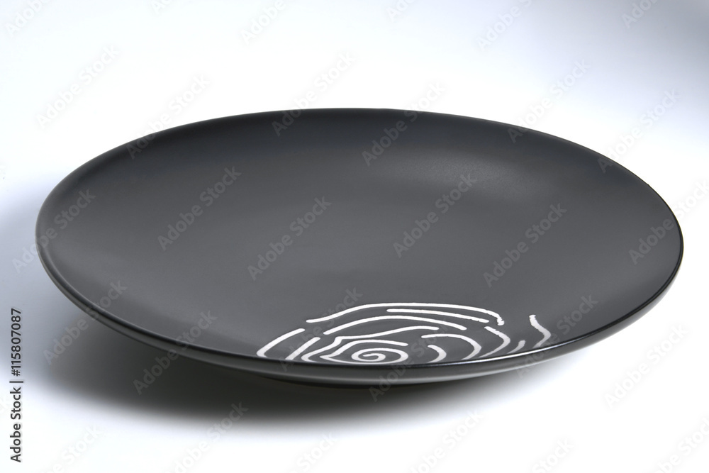 Black plate with rounded edges with decorated interior Black plate with rounded edges with decorated interior