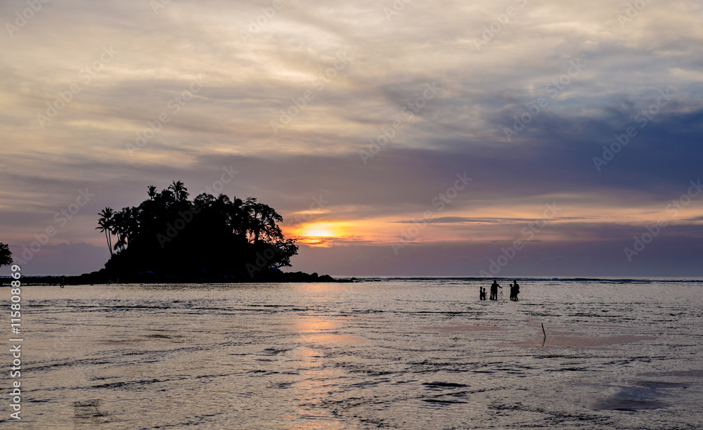 Fisherman with his family is checking nets in the beautiful suns Fisherman with his family is checking nets in the beautiful suns