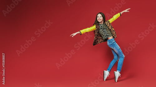 young teenage-girl dancing in laserbeam-discolight