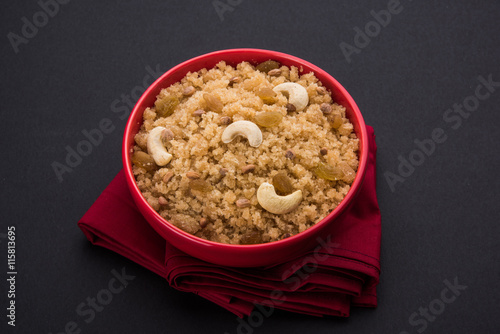 indian gujrati or maharahashtrian or south indian sweet dish lapsi broken wheat sweet pudding payasam pongal or daliya sheera, famous sweet food in india, also known as halwa photo